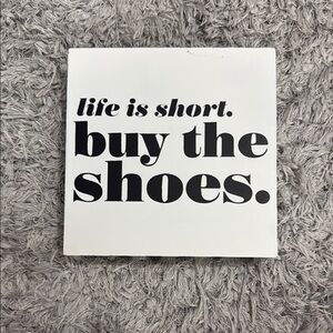 ‘Buy the Shoes’ wall decor